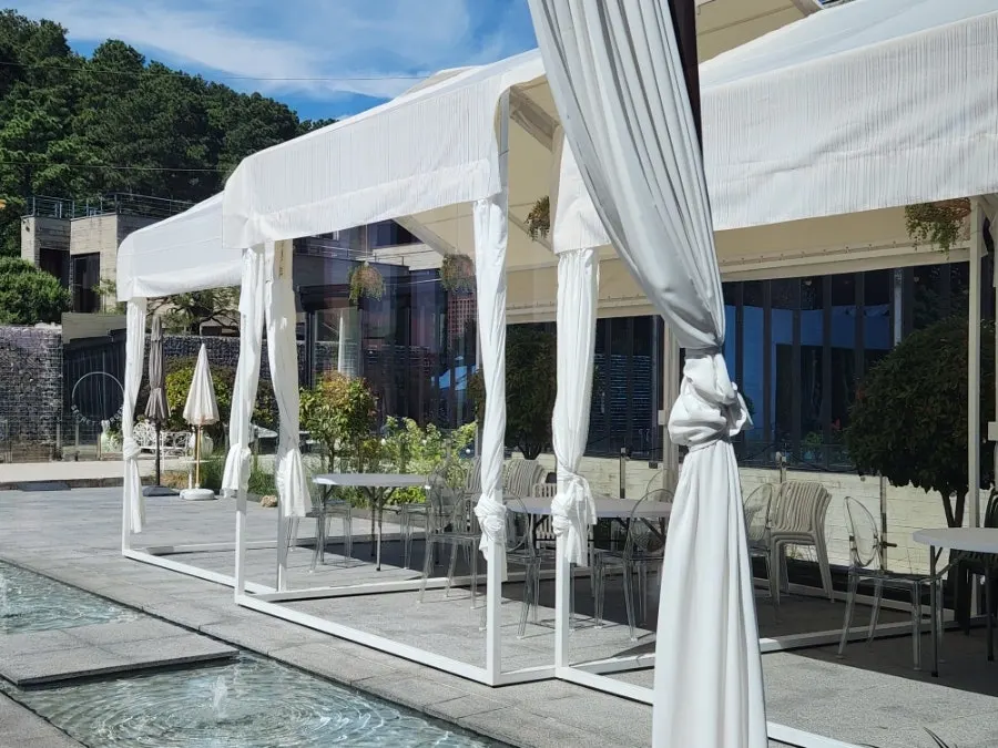 2nd floor outdoor terrace seating with a shade canopy
