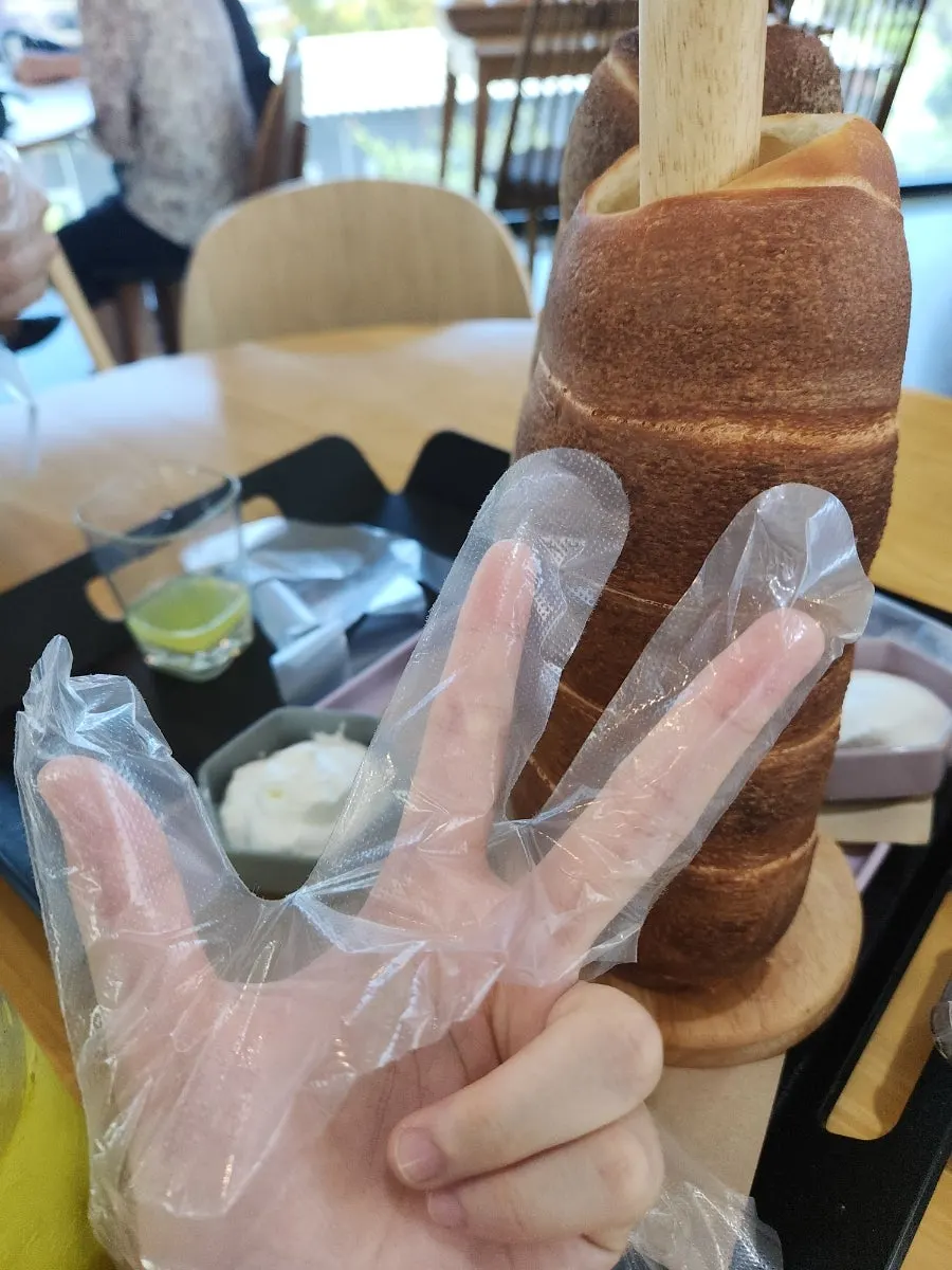 Chimney bread compared in size to a drink cup