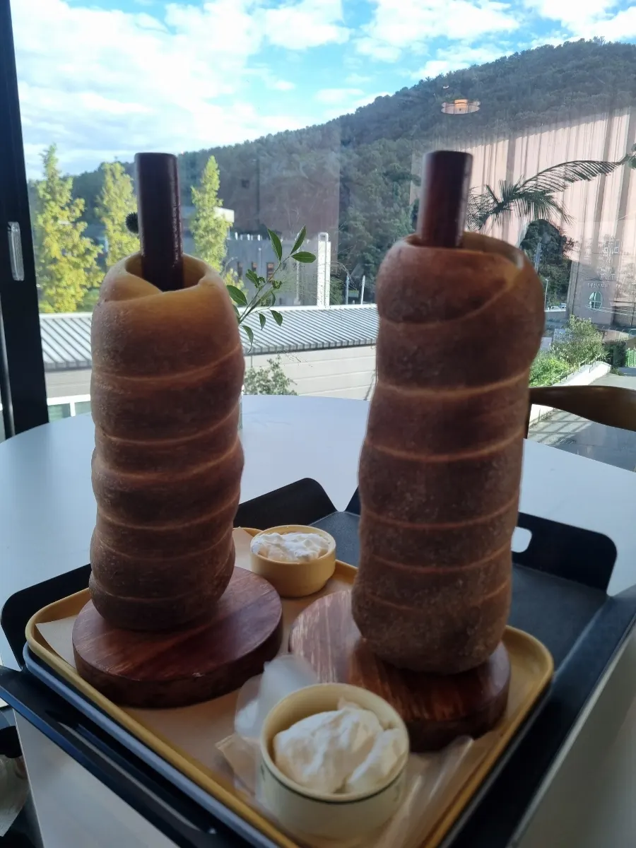 Americano set beside the chimney bread
