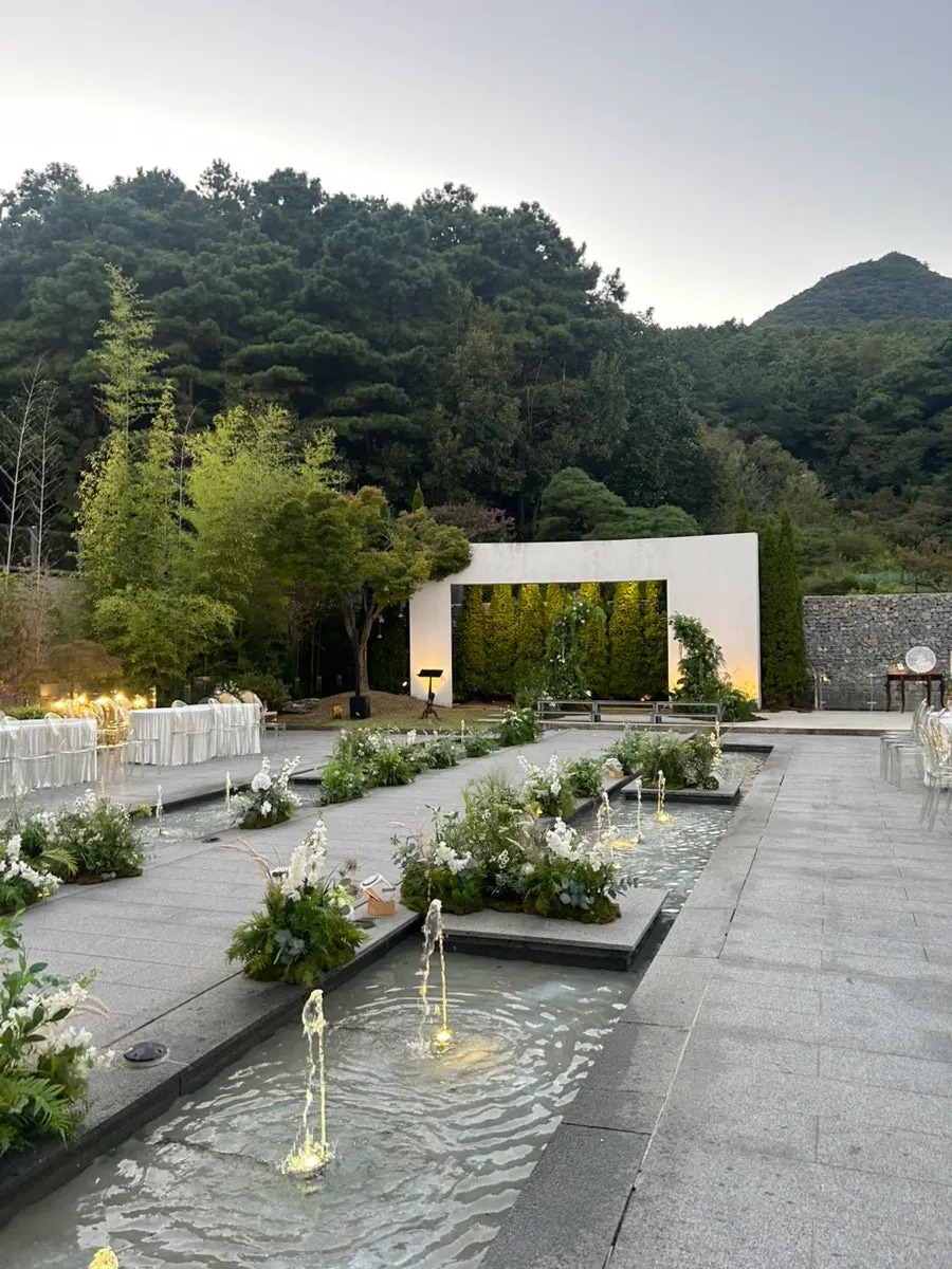 Café seating with a garden view through the window