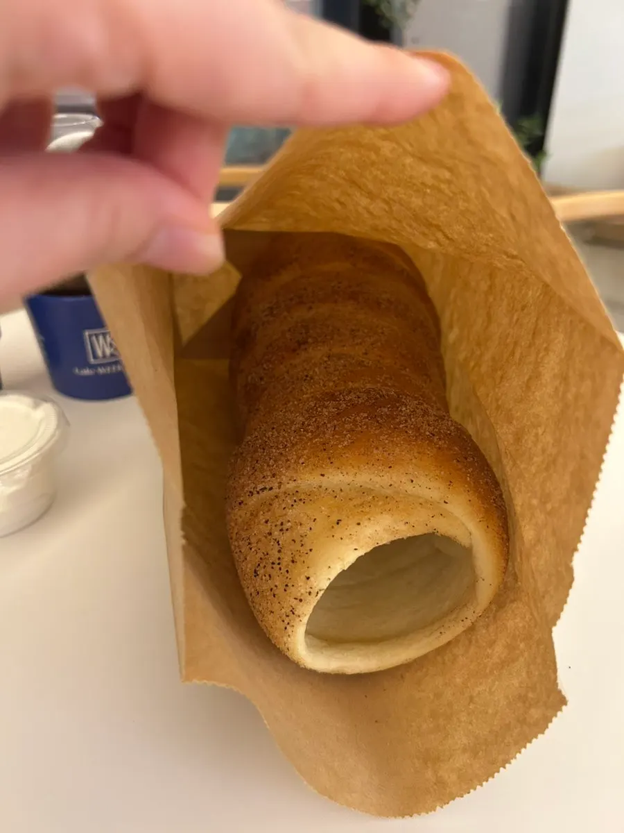 Chimney bread being baked to a golden brown