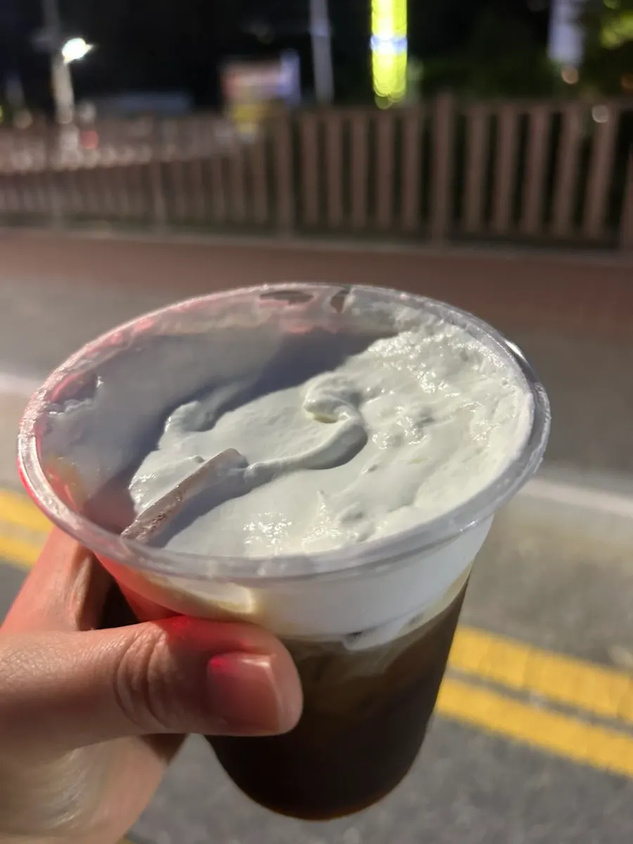 Dipping chimney bread into whipped cream