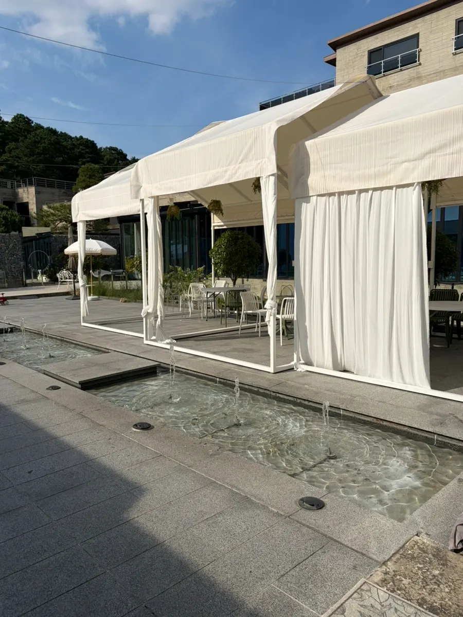 Outdoor café space with green scenery