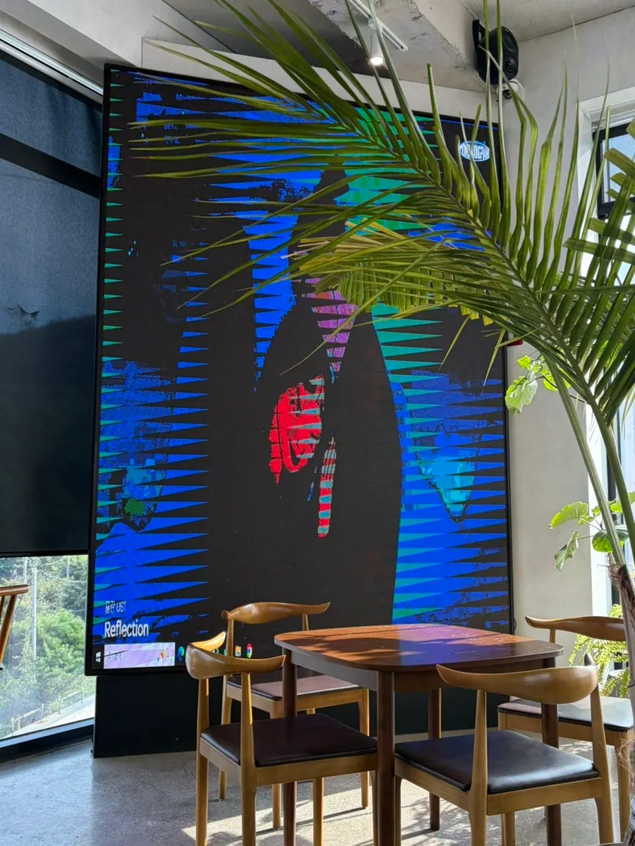 Large in-store screen that changes with the music