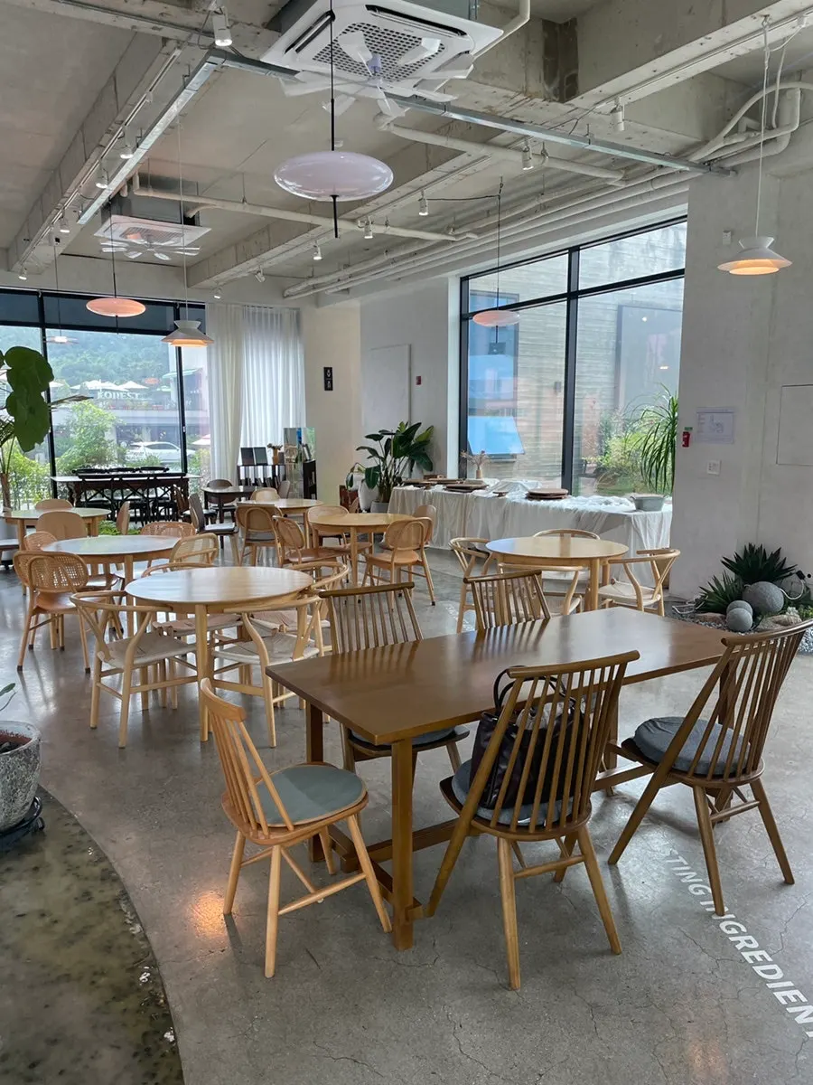 Indoor seating with plants at the large café