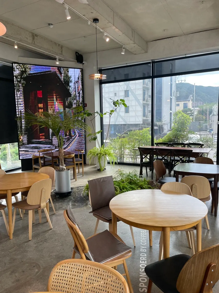 Café hall with tables under warm lighting