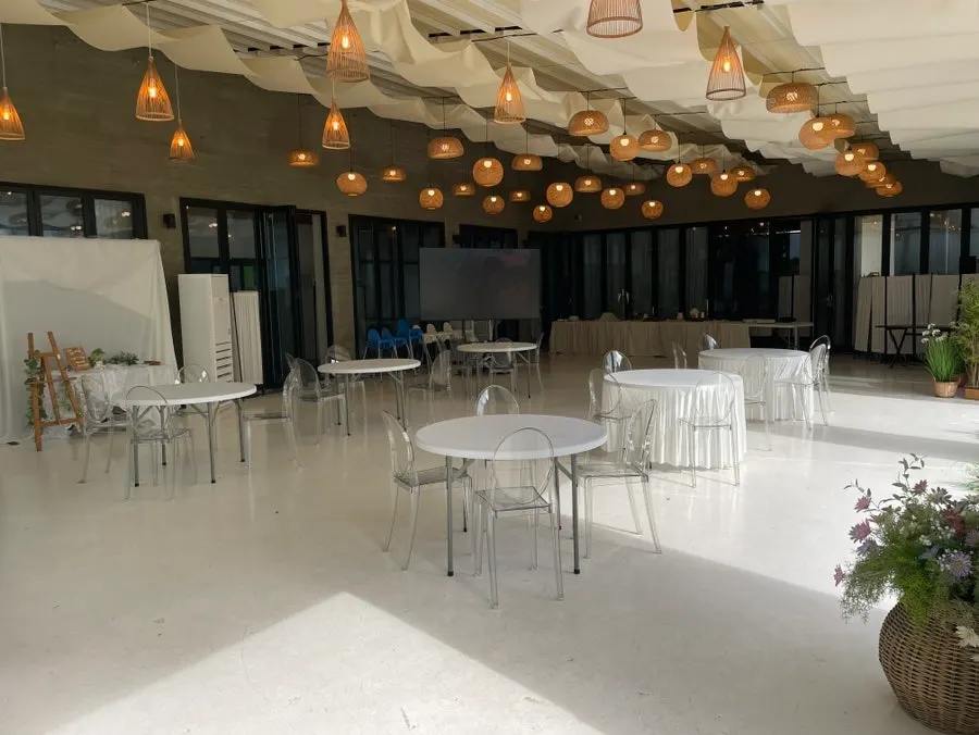 Outdoor terrace seating under a white tent