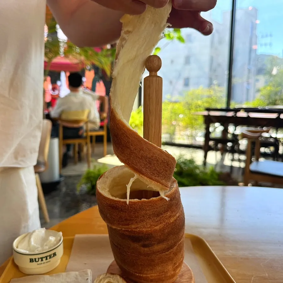 Pulling apart the chimney bread along its ridges