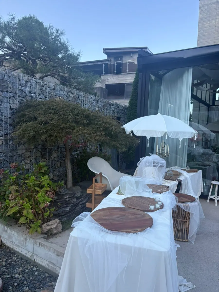 Window-side table with dessert and drinks laid out