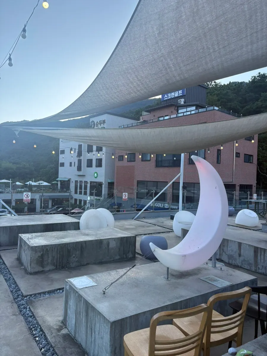 2nd-floor outdoor dome space with a white screen tent
