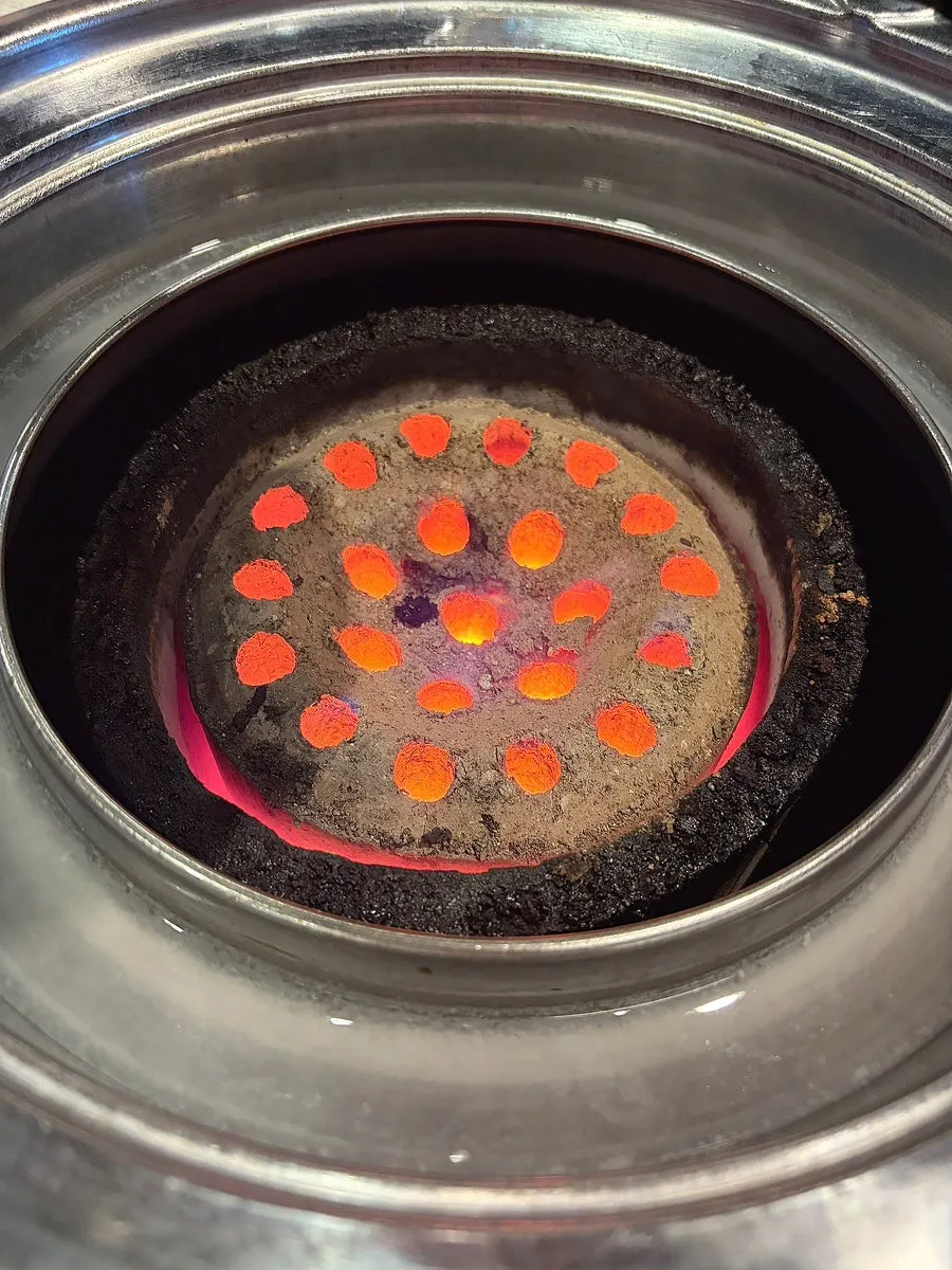 Briquette brazier set at the table