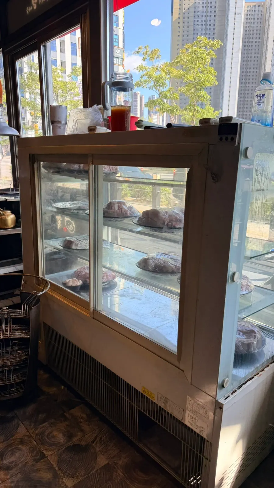Black pork meat fridge displayed at the entrance
