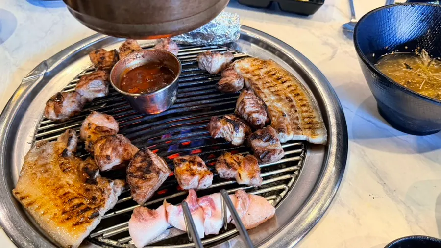 Final table setting with meat and jjigae