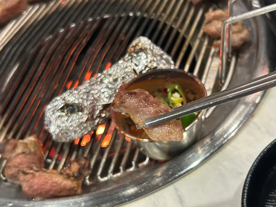Black pork neck wrapped in lettuce