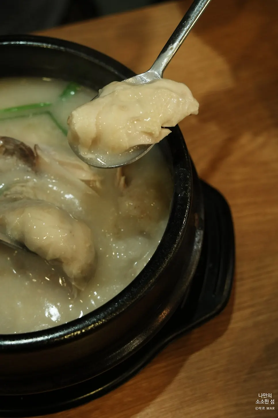 Picked-apart young chicken meat with thick broth