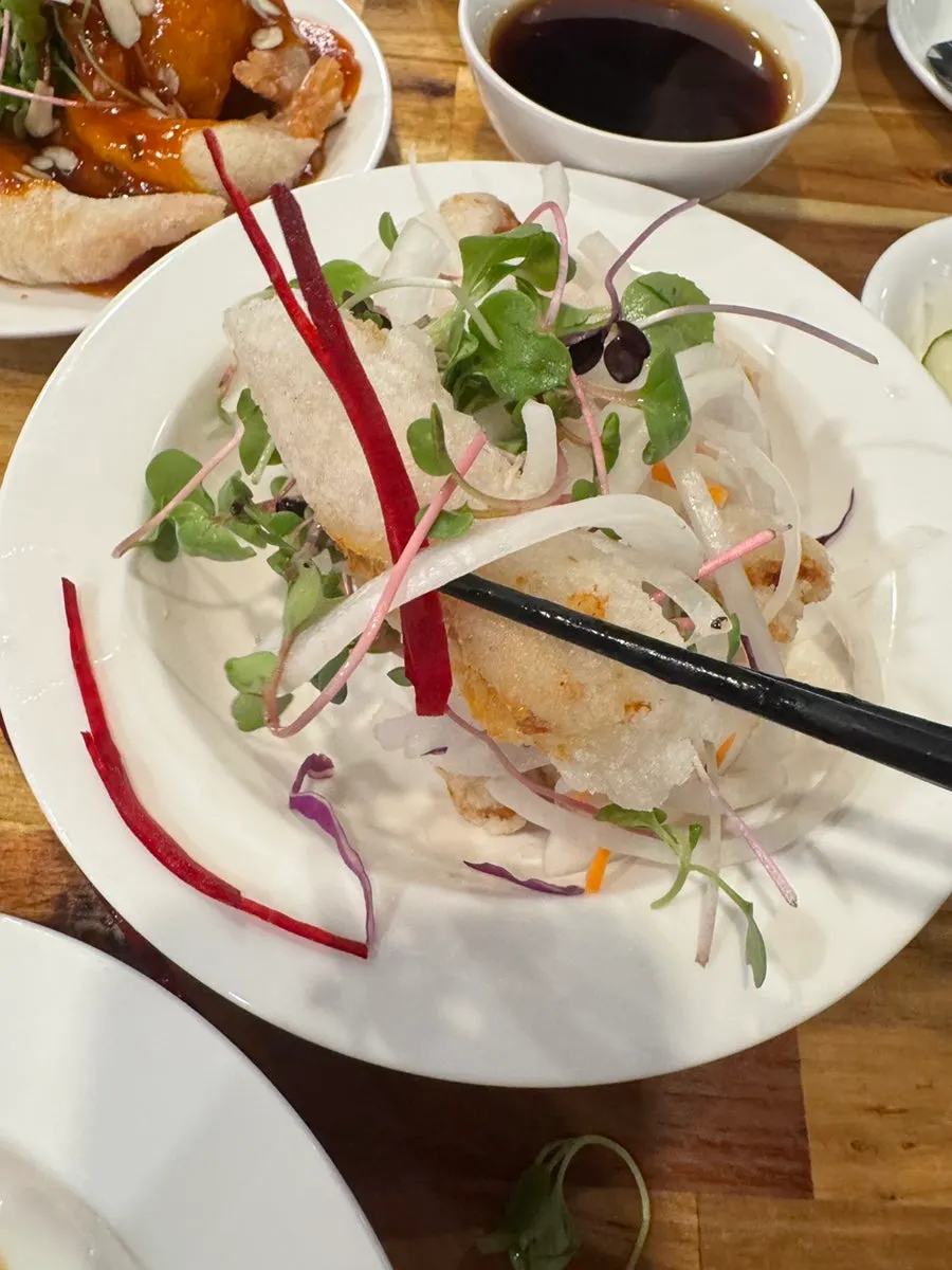 Close-up of the thin, crispy batter on the Beijing sweet and sour pork