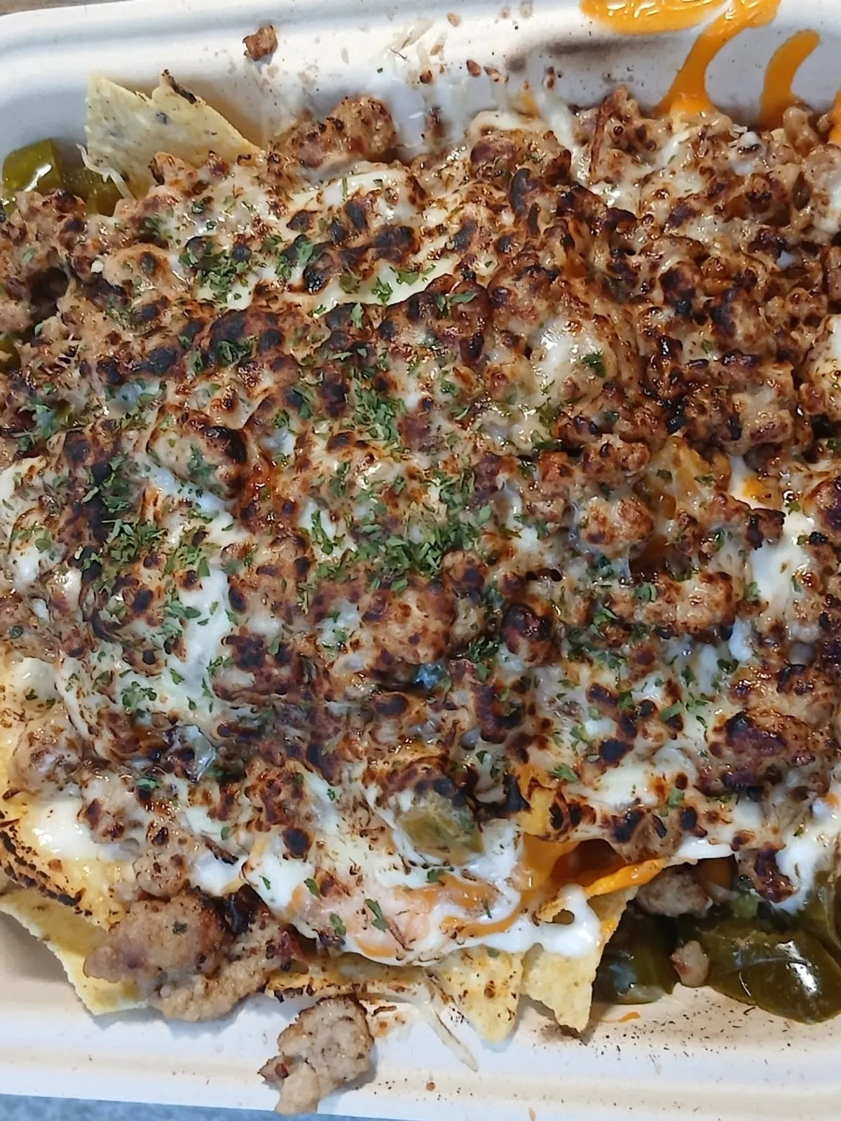 Macho Nacho meat sobo nachos with cheese topping added