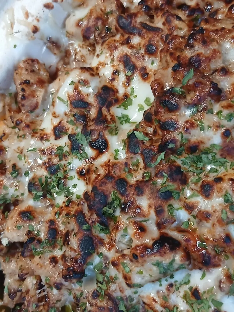 Picking up a bite-sized piece of nacho
