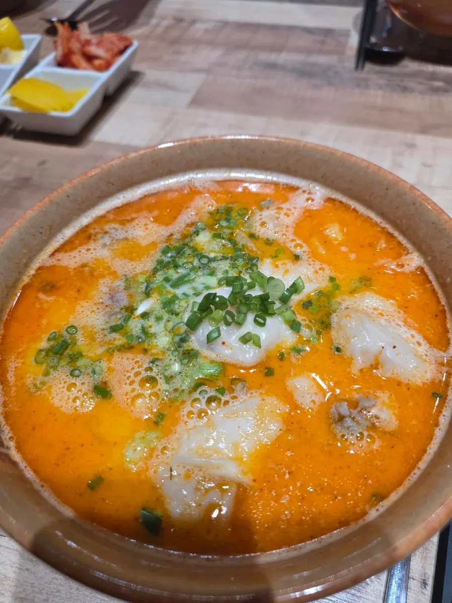 Rich broth of the beef brisket pho with plenty of meat