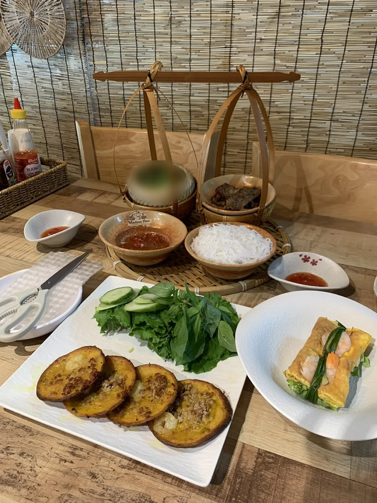Bun cha and banh khot served together at Madam Hao