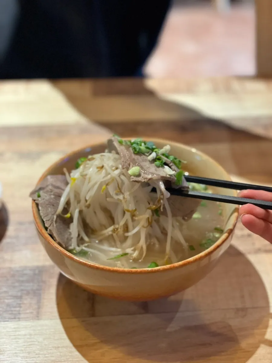 Rice noodles lifted up, well matched with the broth