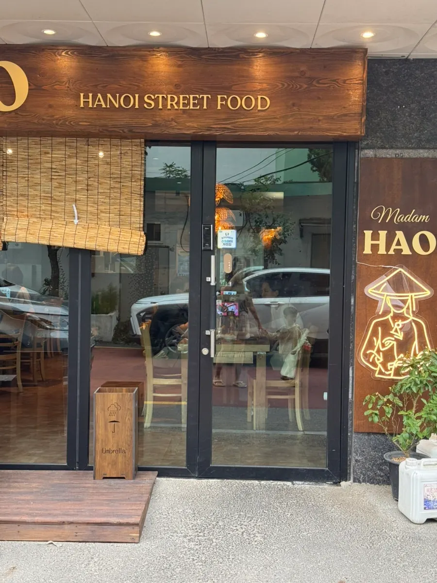 Entrance of Madam Hao with a Vietnamese restaurant atmosphere