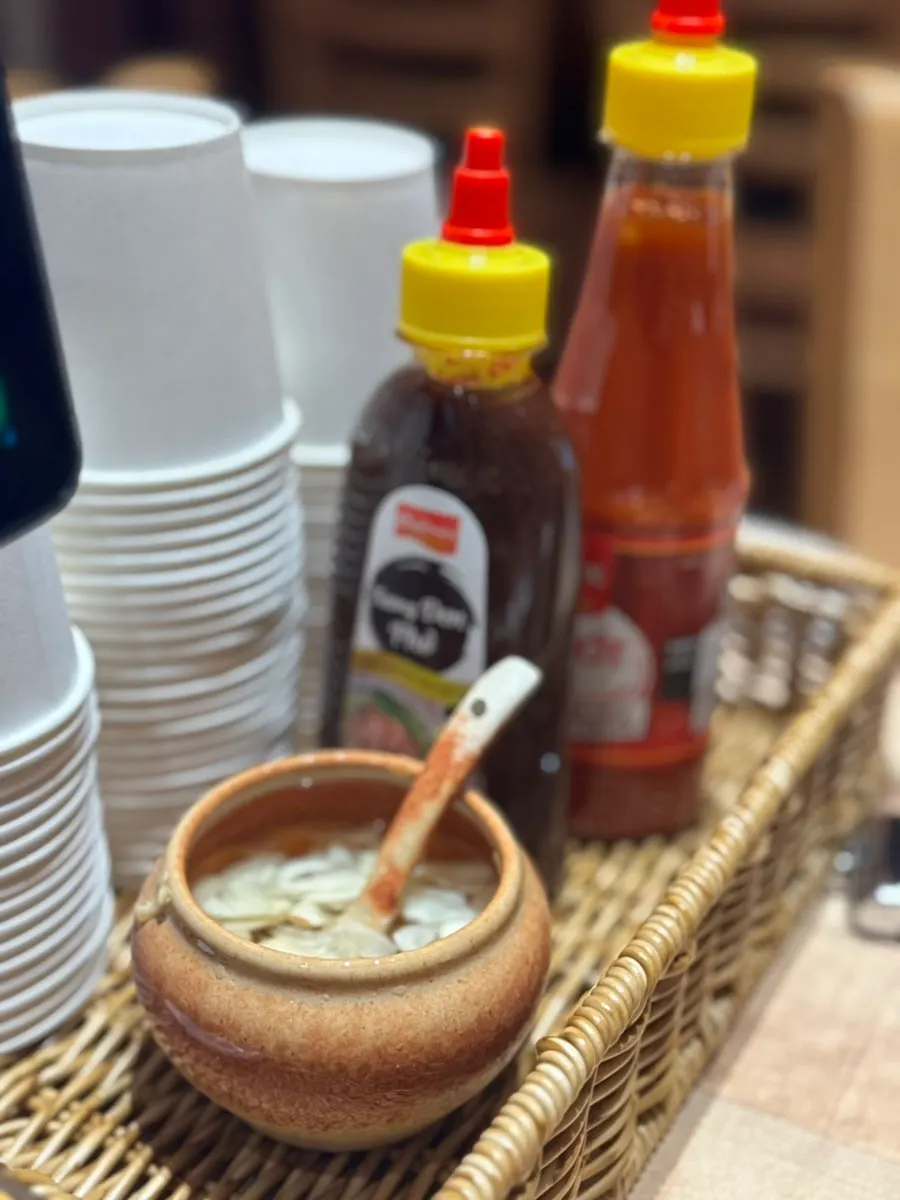 Sauce and garlic vinegar set on the table