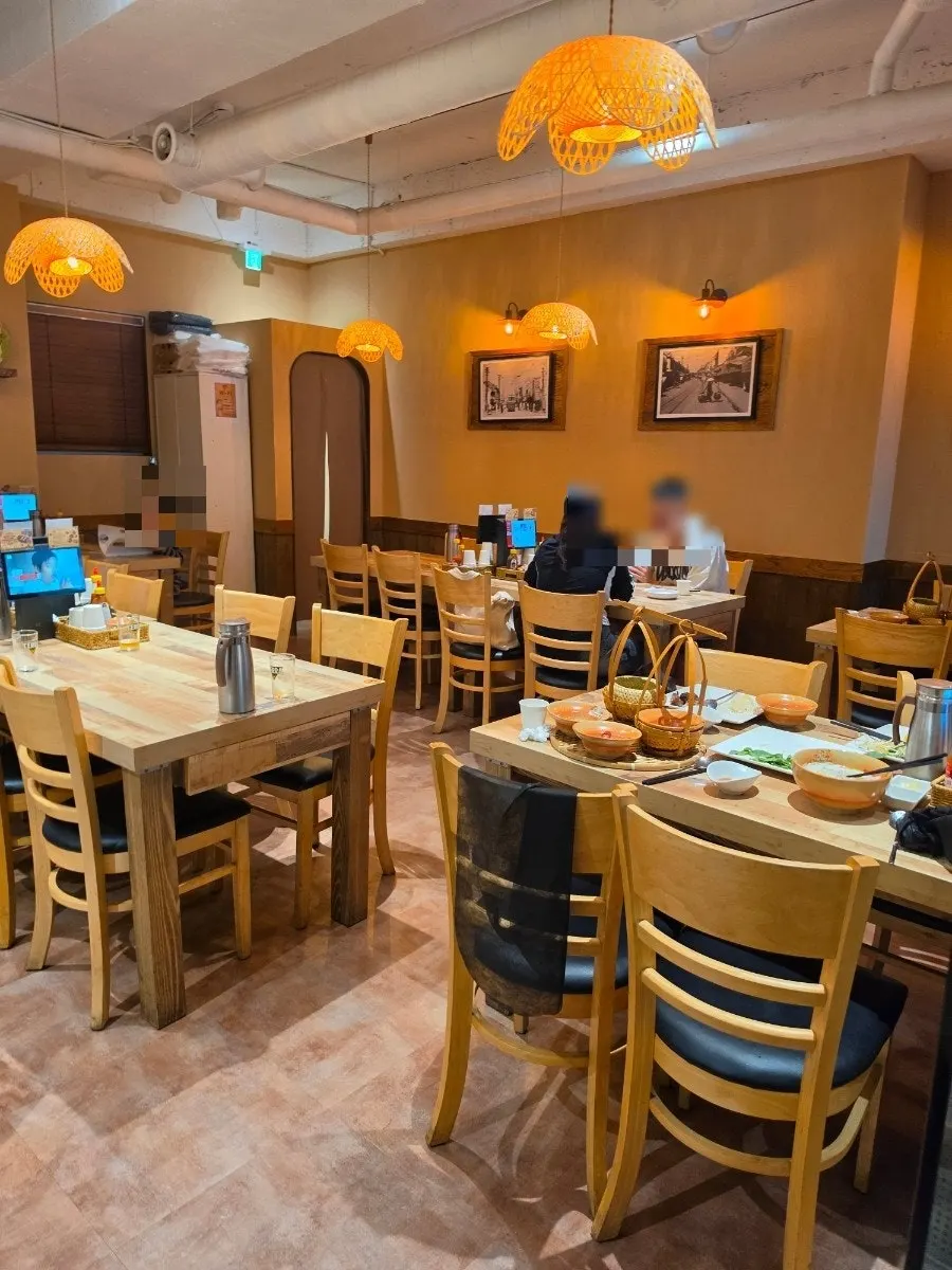 Seating at Madam Hao with generous table spacing