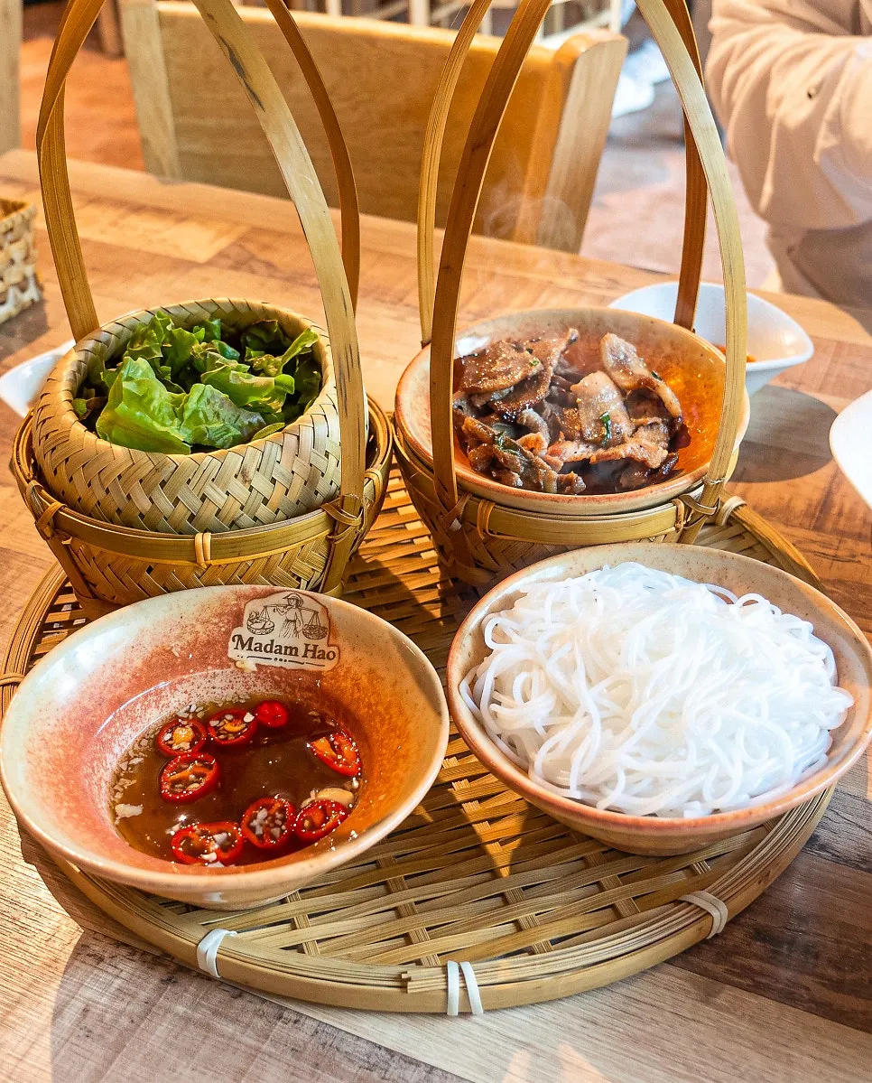 Bun cha served in a bamboo basket
