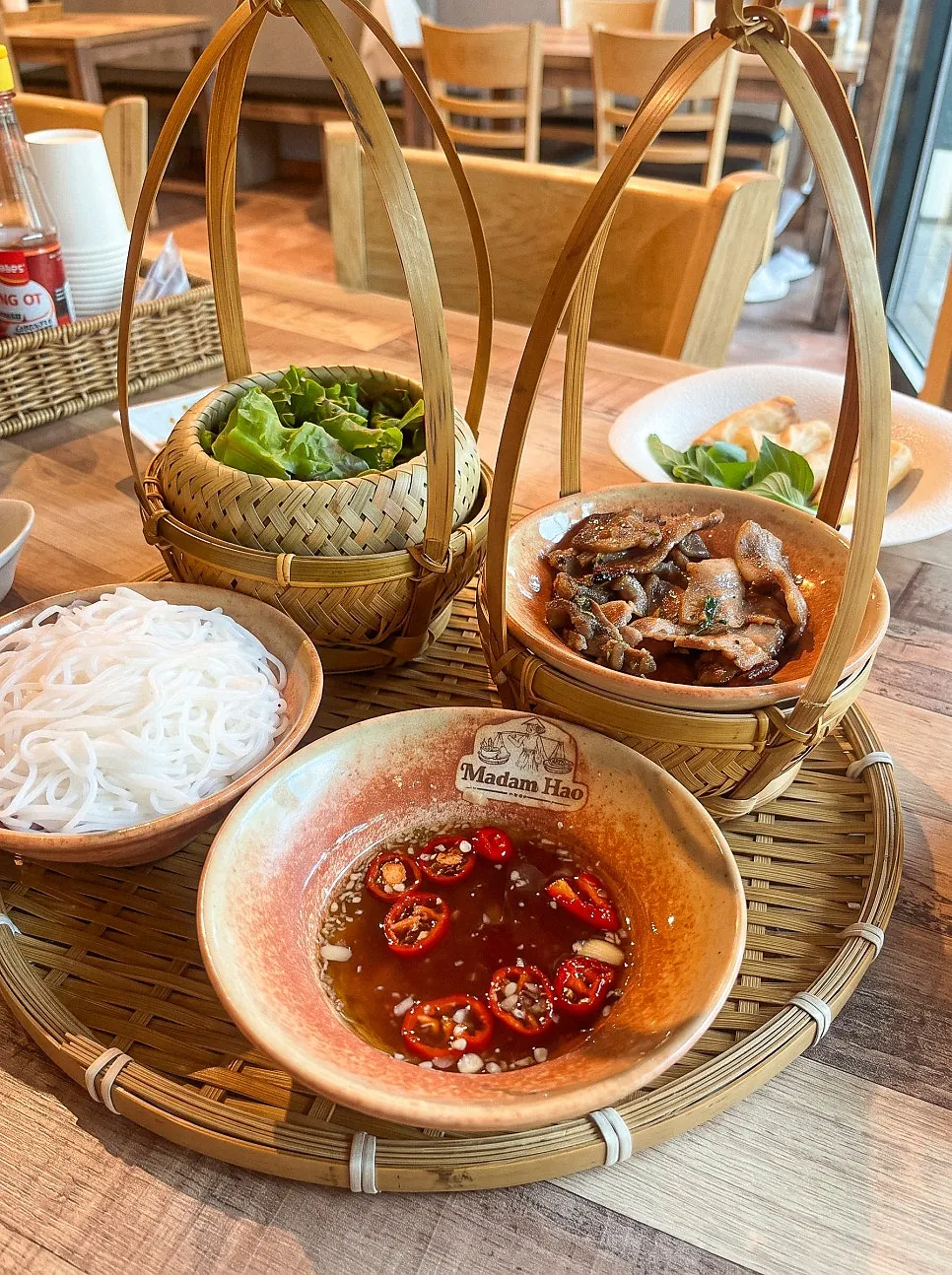 Bun cha with lettuce, rice noodles, and charcoal-grilled pork