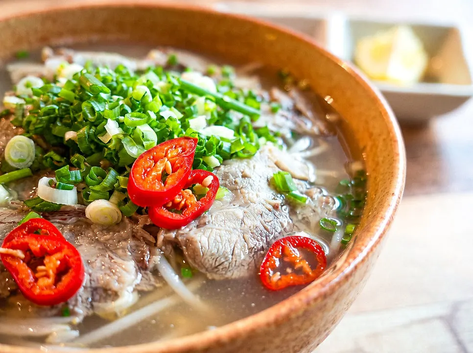 Clear broth of the beef brisket pho