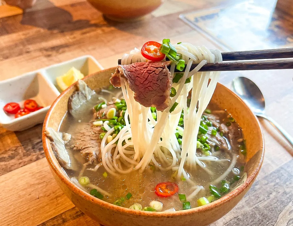 Beef brisket pho with Thai chili and lime added