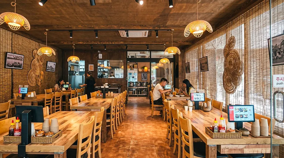 Restaurant wall decorated with photos of Hanoi streets