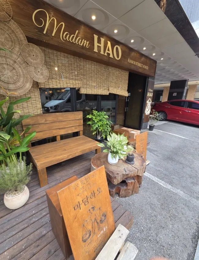 Madam Hao's exterior and entrance decorated with plants