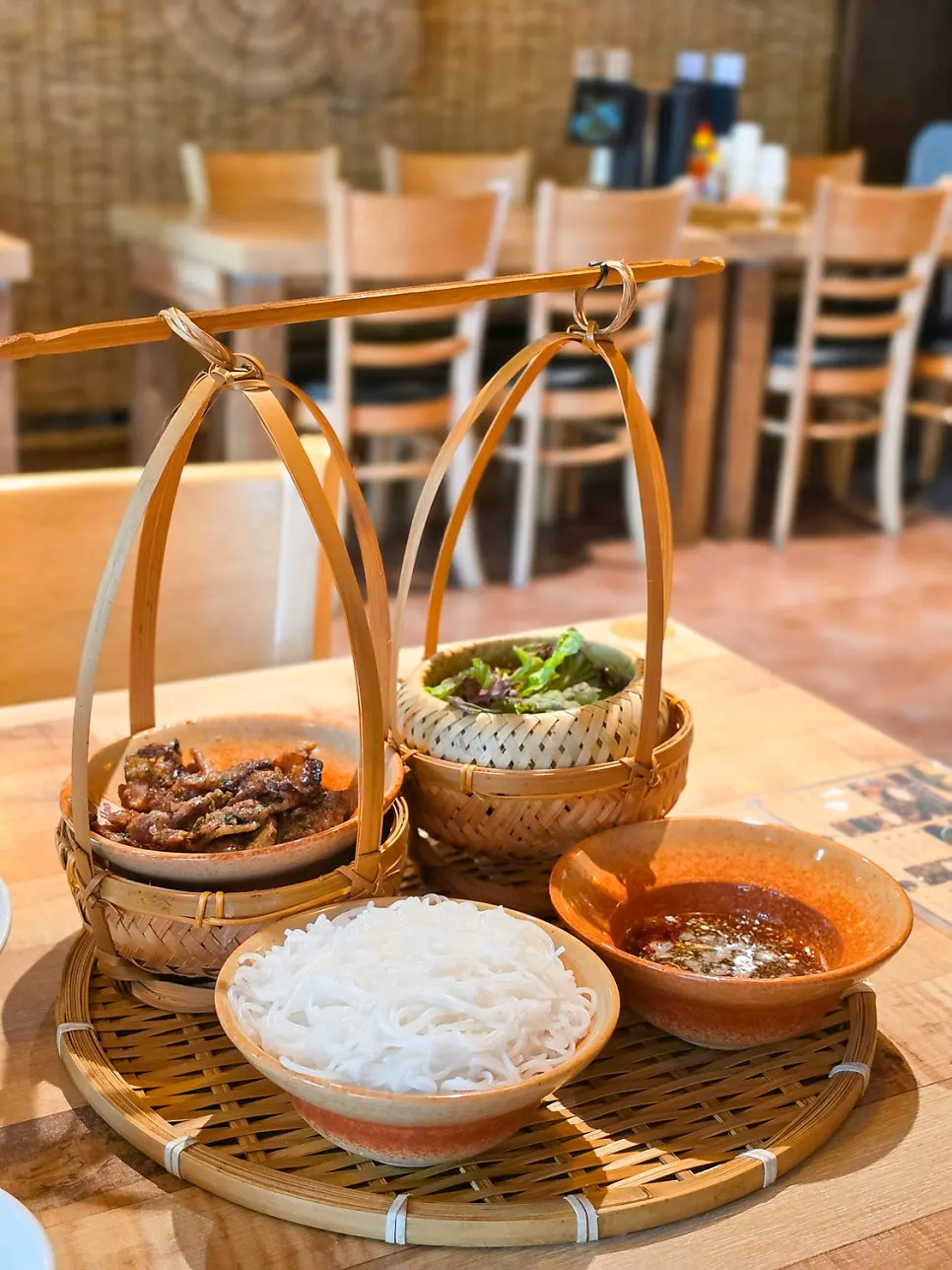 Lunch table set with bun cha and cha gio together