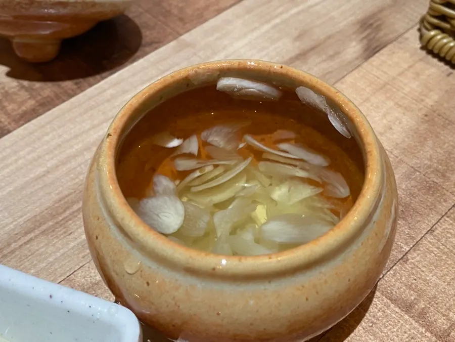 Small dish of sliced garlic pickled in fish sauce