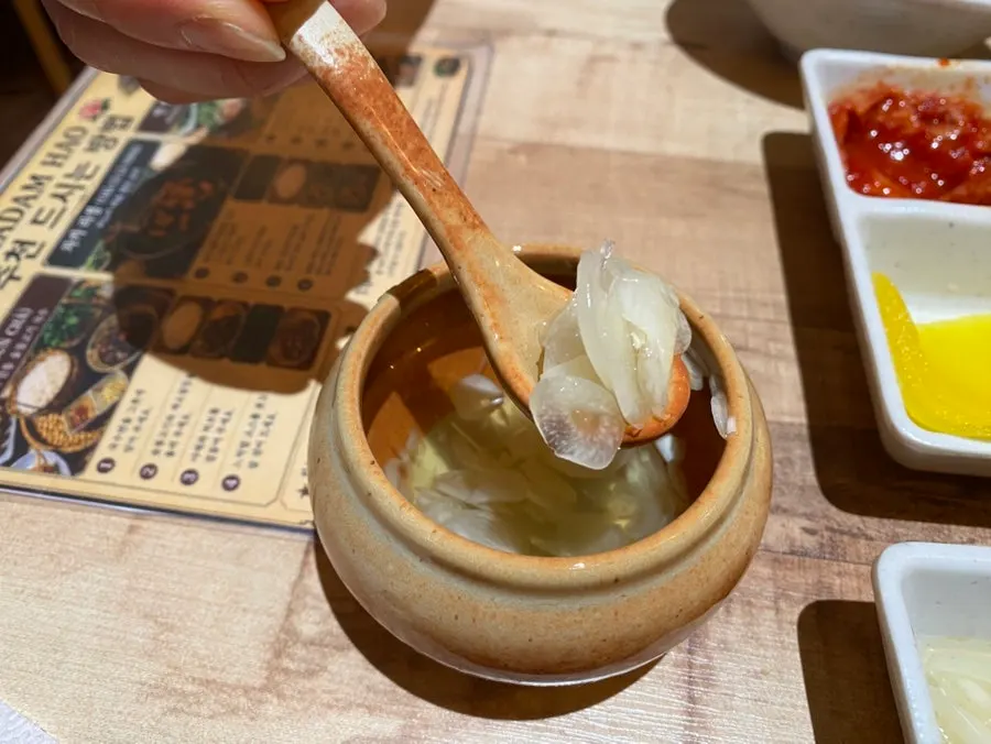 Sauces and pickled garlic set out on the table