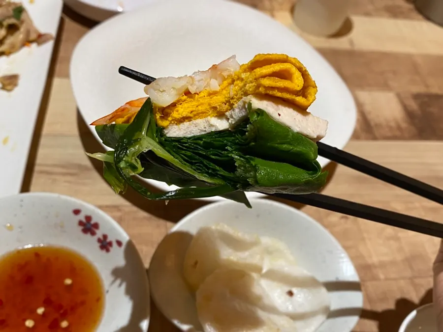 Close-up bite of a northern-style summer roll