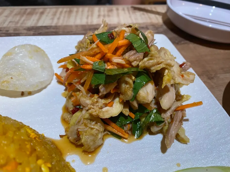 Vietnamese-style chicken rice bowl with cucumber and shrimp crackers