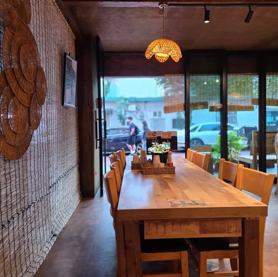 Window seating with wooden tables and chairs