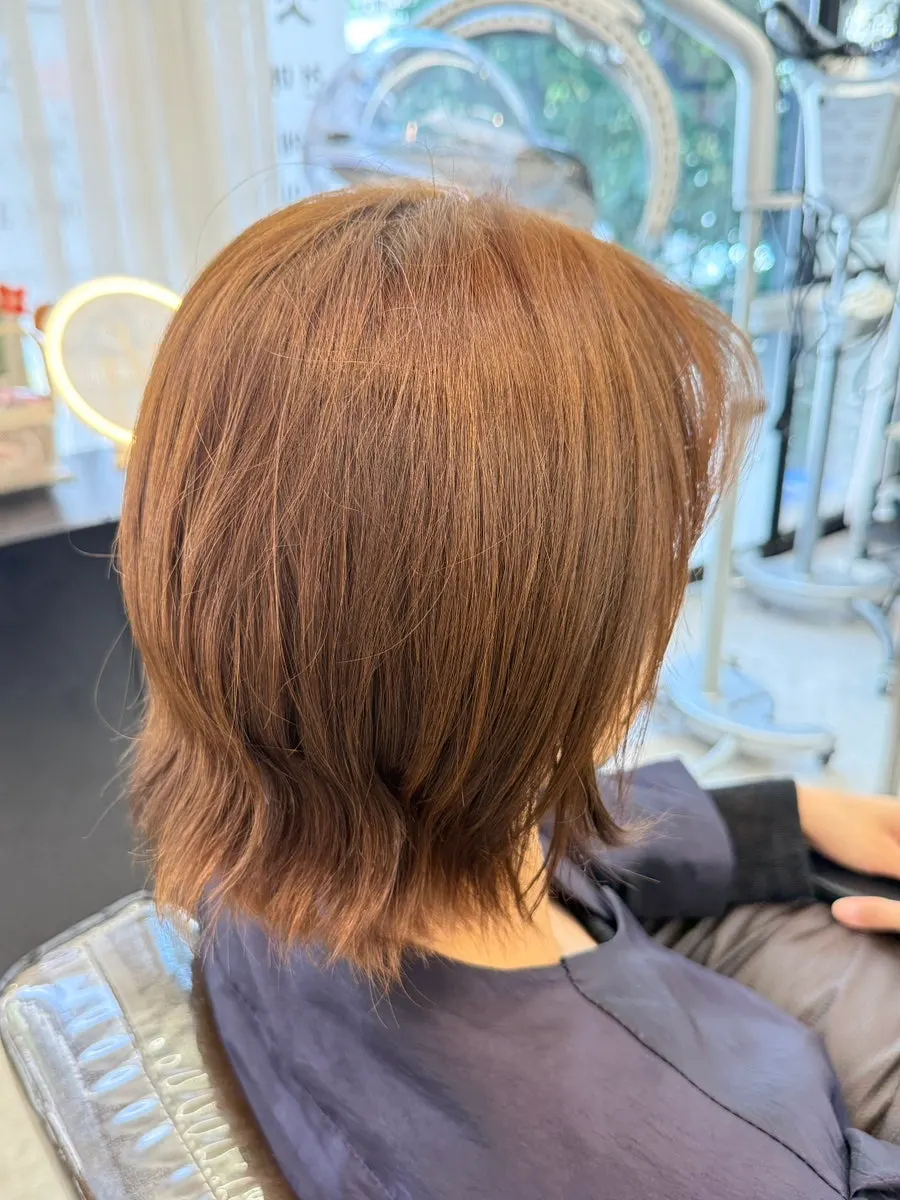 Checking hair condition during color consultation