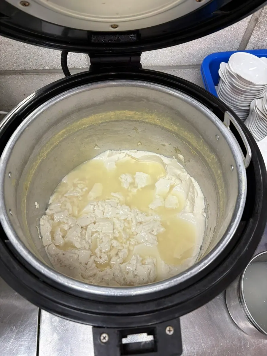 A bowl of warm sundubu scooped self-serve