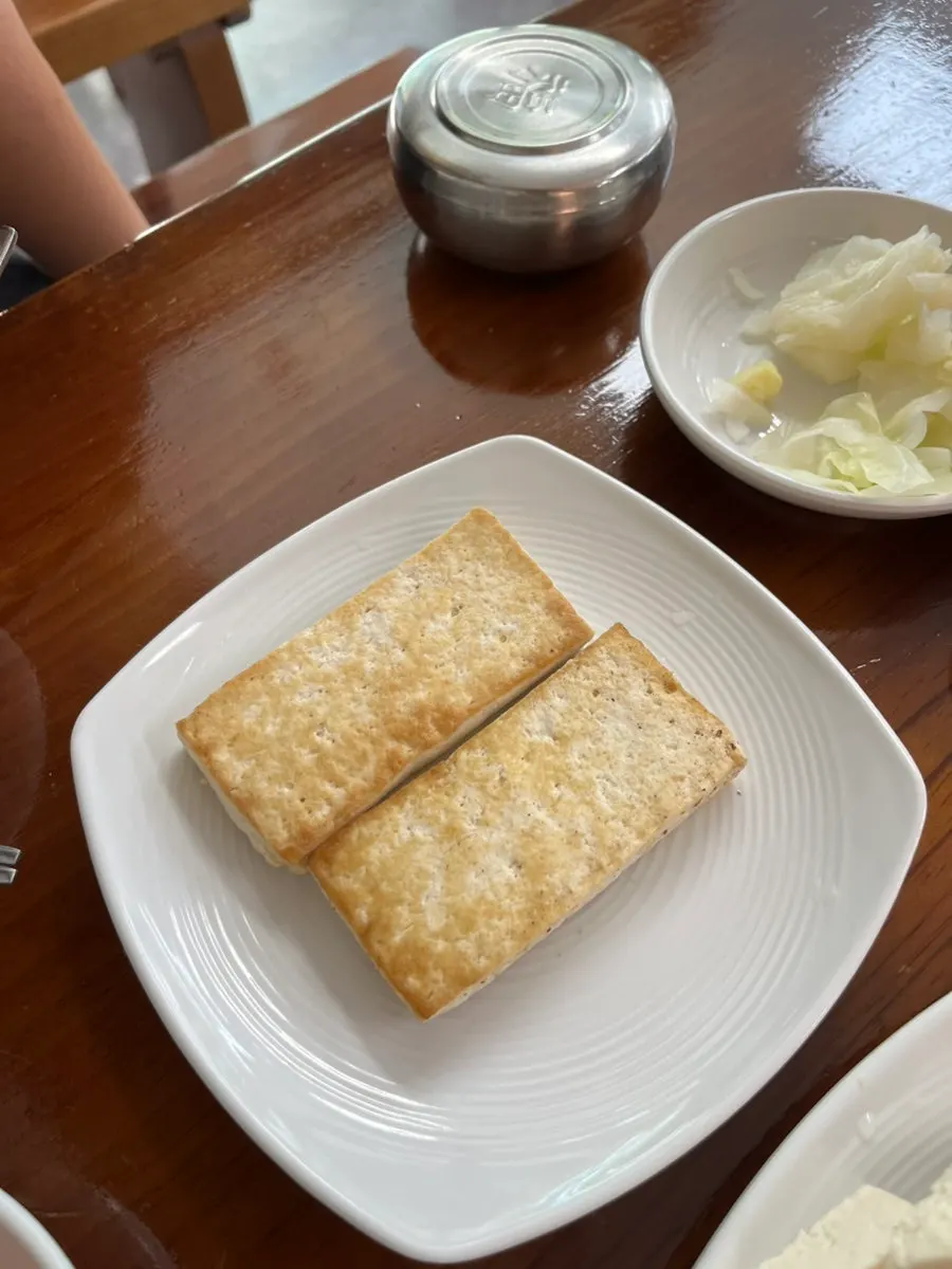 Set meal with tofu salad, plain tofu, bossam, and tofu hot pot