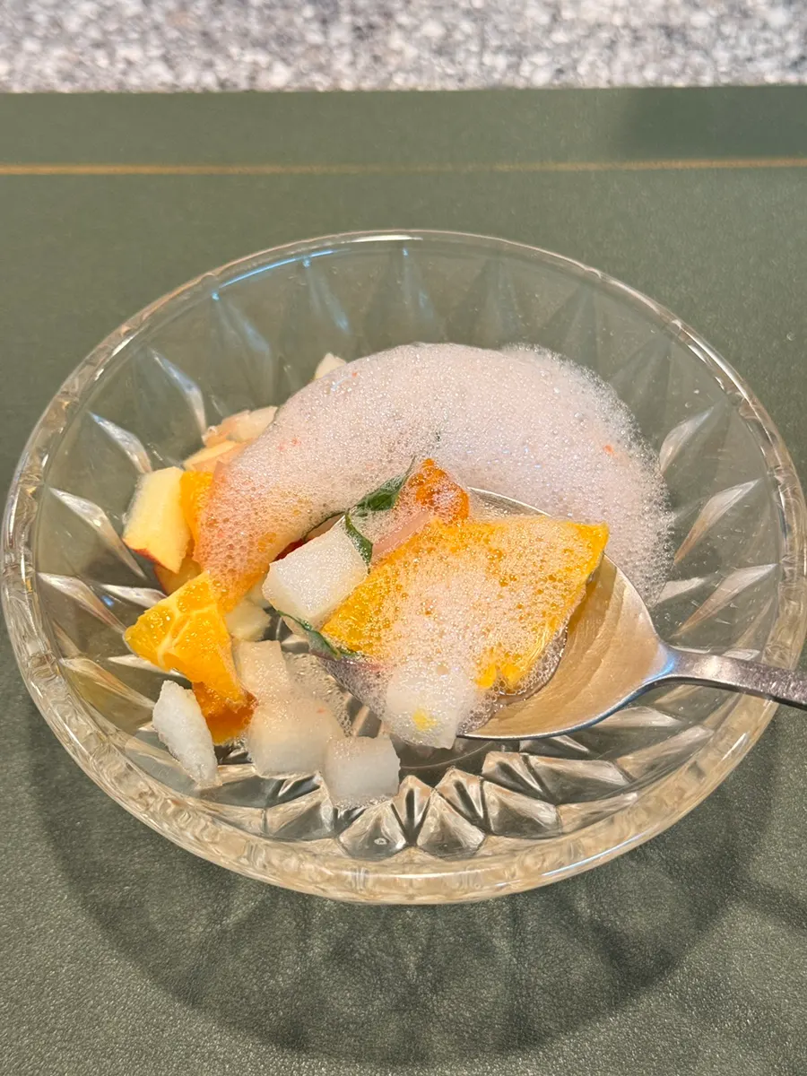 Salad topped with persimmon vinegar foam sauce