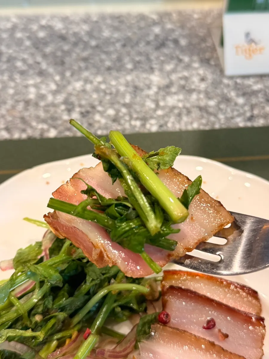 Chewy pork dish served with minari