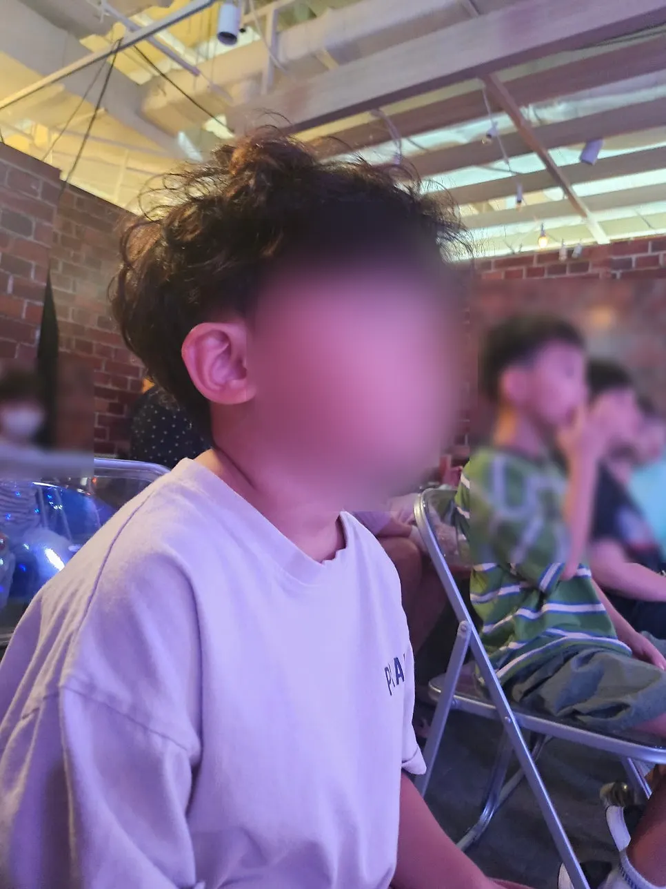 Children in the audience fully focused on the show