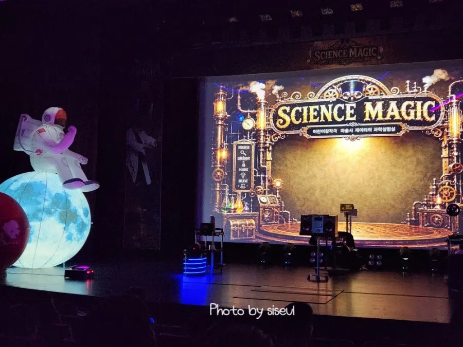 Magician JT appearing on stage