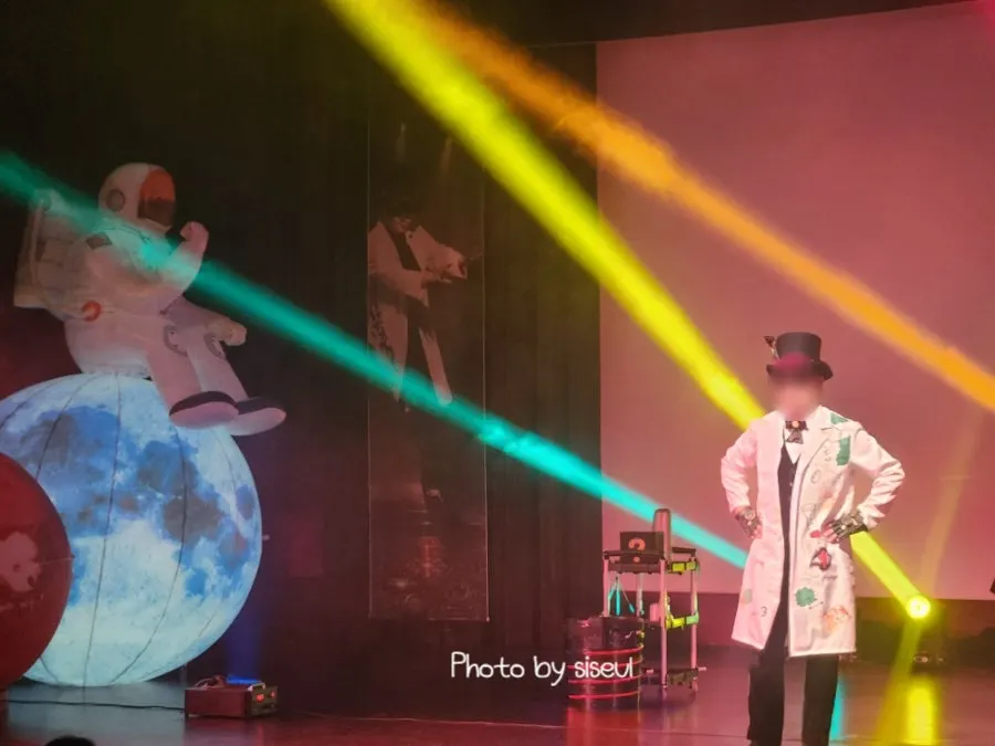 Kids in the audience receiving magic coupons
