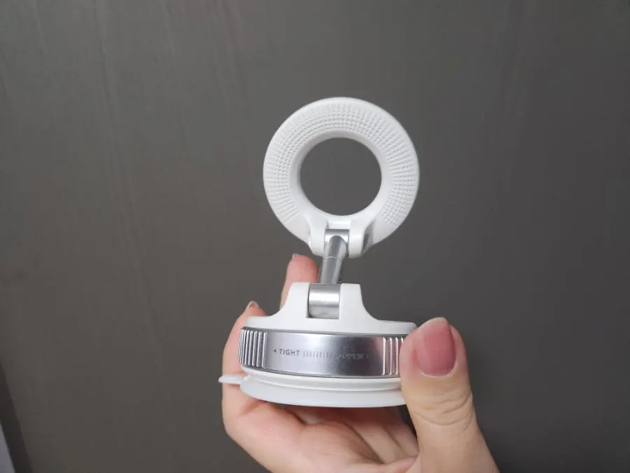 Phone mount secured with vacuum suction