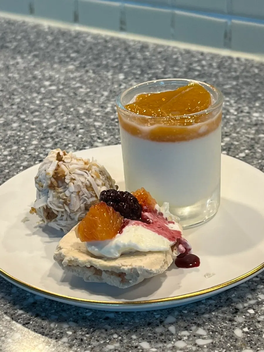 Milk pudding served with ripe persimmon compote